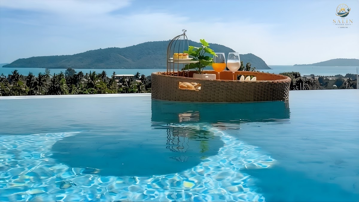 Floating breakfast tray in the infinity pool with the sea beyond